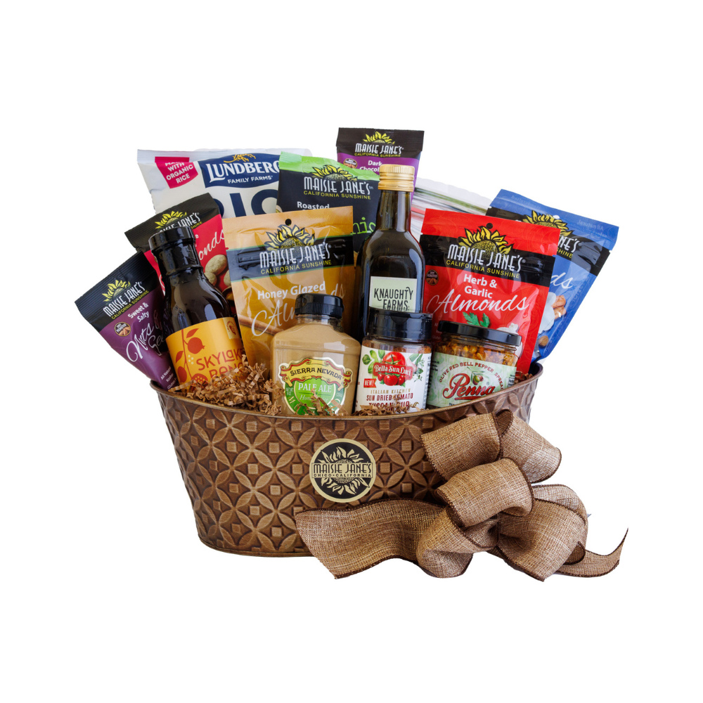 Gift basket with various snacks and drinks on a white background