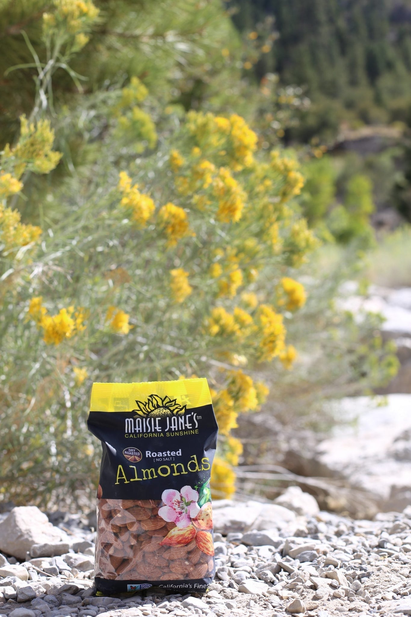 bag of Maisie Jane's Almonds outside near flowers