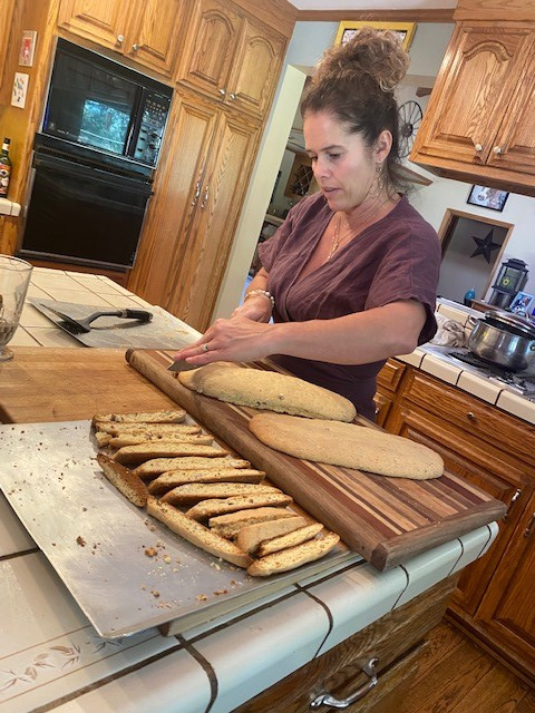 Maisie Jane cutting biscotti dough