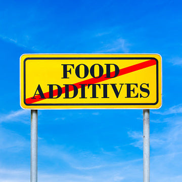 road sign with Food Additives with a red line across it 