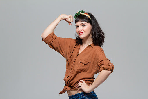 happy-woman-flexing-muscle