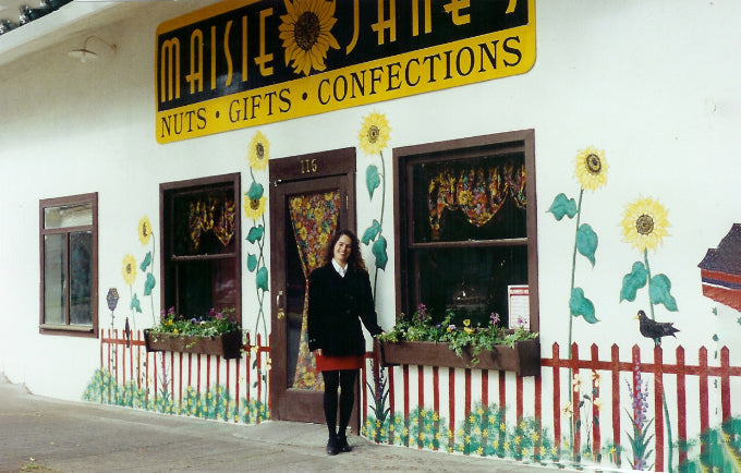 Maisie Jane standing in front of her first storefront for Maisie Janes