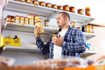 man choosing a nut butter