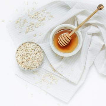 honey and oats on a white towel