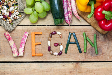 vegan written out in plants and fruits and veggies