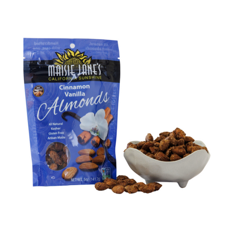 Bag of Maisie Jane's Cinnamon Vanilla Almonds with a bowl of almonds on a white background