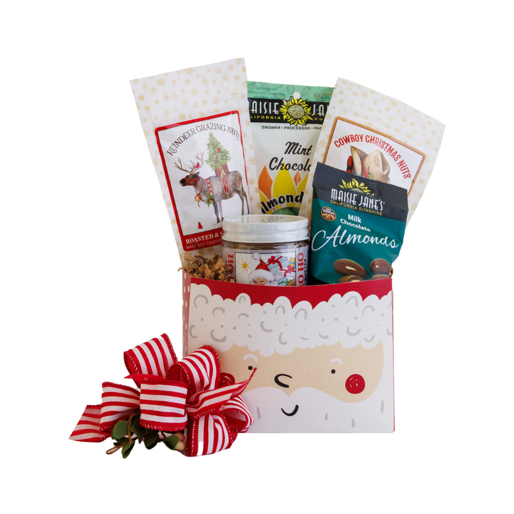 Gift basket with Santa face design and various snacks on a white background