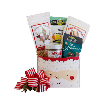 Gift basket with Santa face design and various snacks on a white background