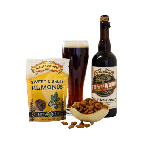 Sierra Nevada Sweet & Salty Almonds package with a bottle of Trip to the Woods beer on a white background