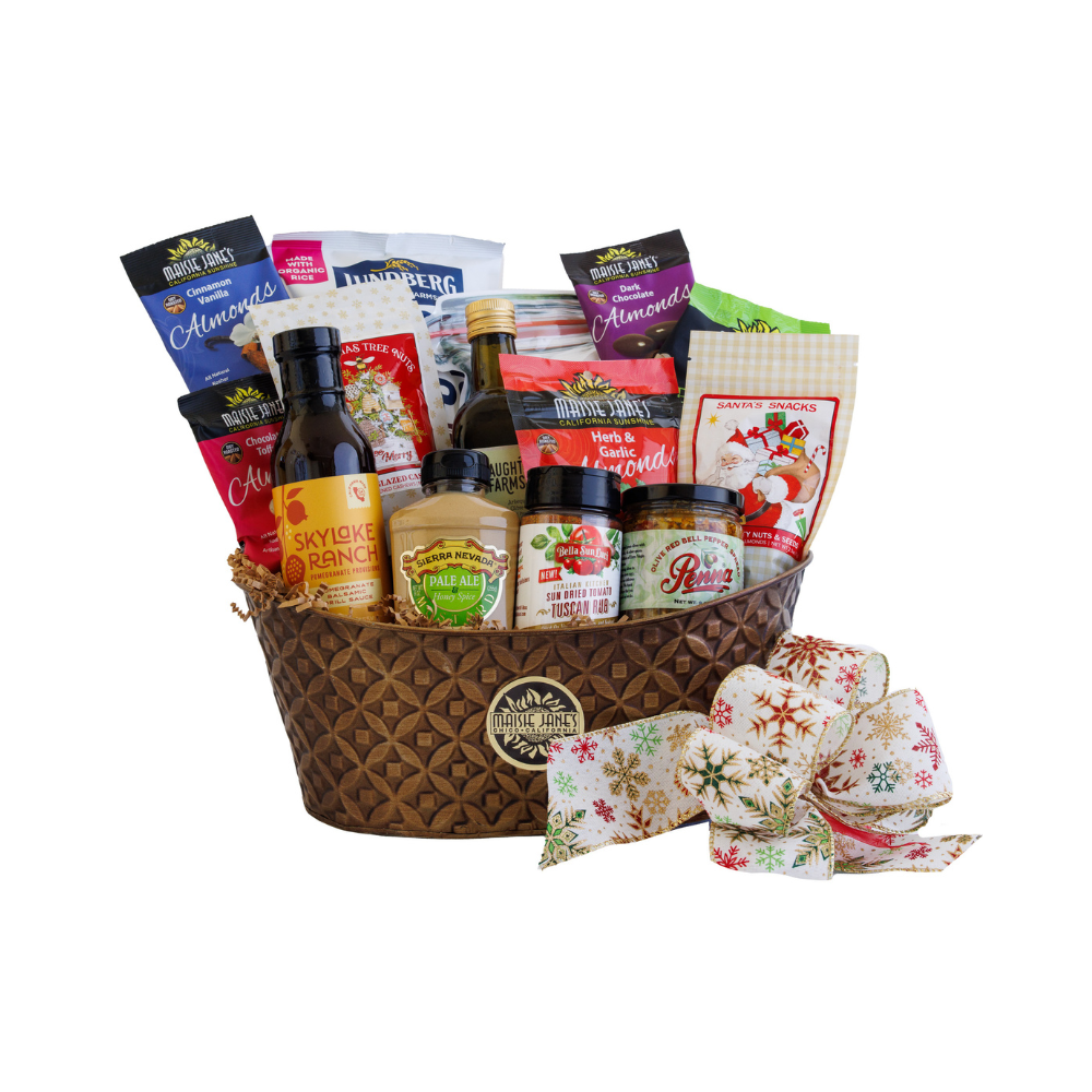 Gourmet gift basket with various snacks and condiments on a white background