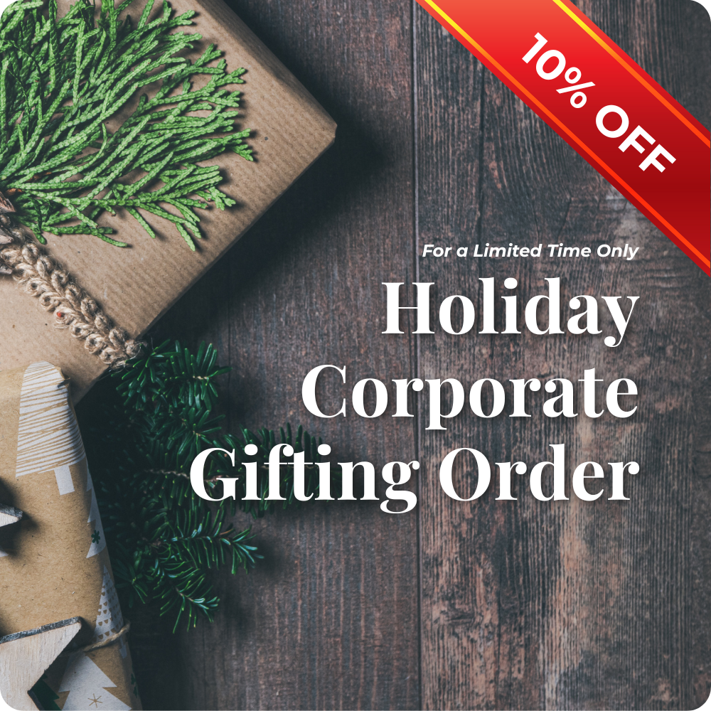 Promotional graphic for holiday corporate gifting with gift boxes and tinsel on a wooden surface, featuring a 10% discount offer.