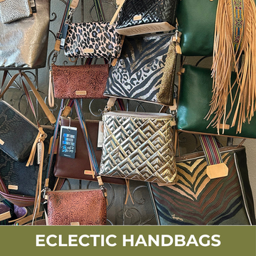 Collection of various handbags with different designs and colors on a stand, labeled 'Eclectic Handbags'.