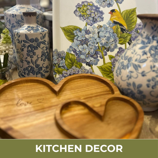 Kitchen decor with floral-patterned vases and a wooden heart-shaped object.