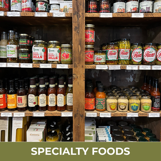 Shelves stocked with various jars and bottles labeled 'Specialty Foods'.